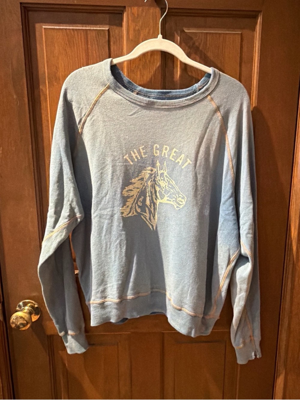 THE GREAT. Light Blue Pullover Sweatshirt with Horse Graphic